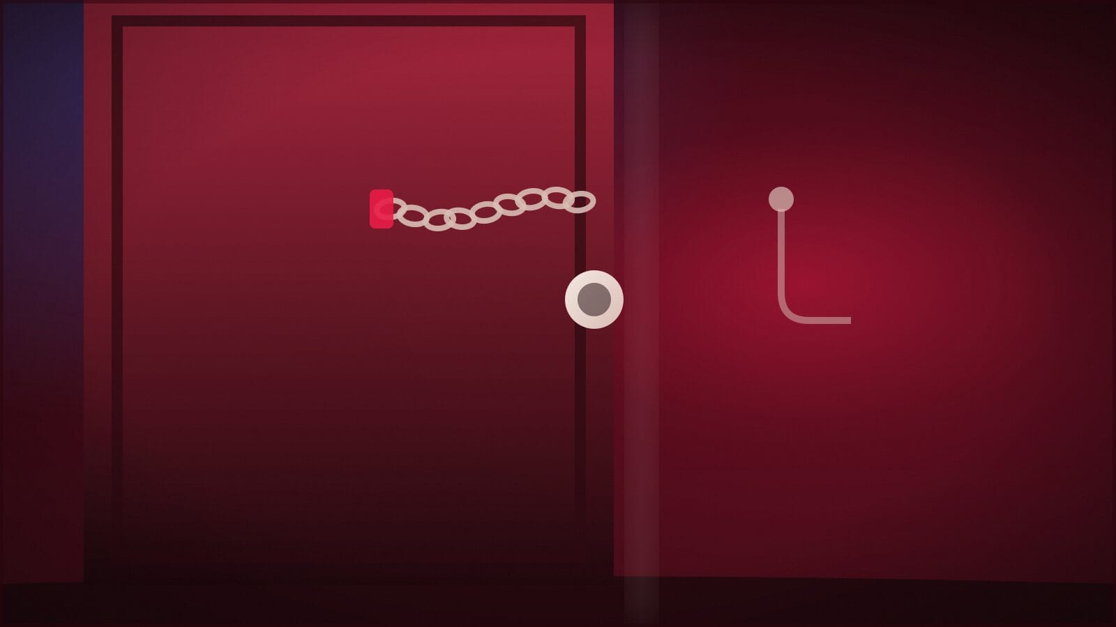 A front door with the chain across it and a key hanging on a hook beside it.