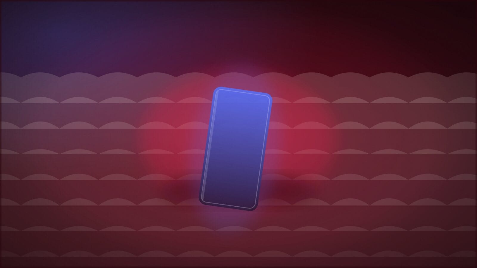 A phone lying screen-up on a duvet, its light spilling across the folds.