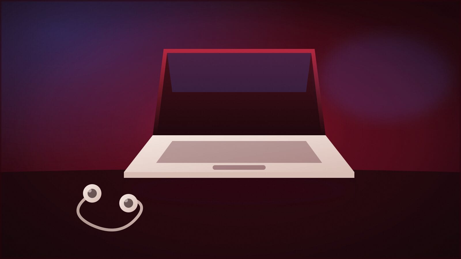 An open laptop and a pair of earbuds on a dark desk at night.